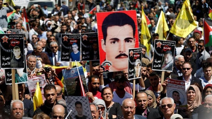 Demonstrators gather during a rally in support of Palestinian prisoners on hunger strike in Israeli jails, in the West Bank city of Ramallah April 17, 2017.