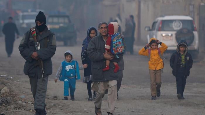 Afghan family leaves site of attack in Kabul, Afghanistan, December 22, 2016. © 2016 Reuters