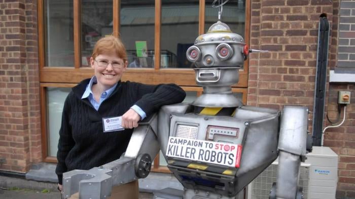 Bonnie Docherty, senior researcher at Human Rights Watch, with a “friendly robot” at the launch of the Campaign to Stop Killer Robots, April 2013. 