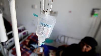 Woman holding child in a hospital in Yemen