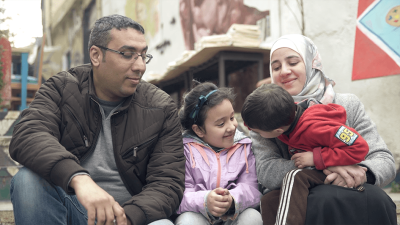 A picture of a Jordanian mother with her husband and children. Her husband and children are not allowed to receive Jordanian citizenship. 