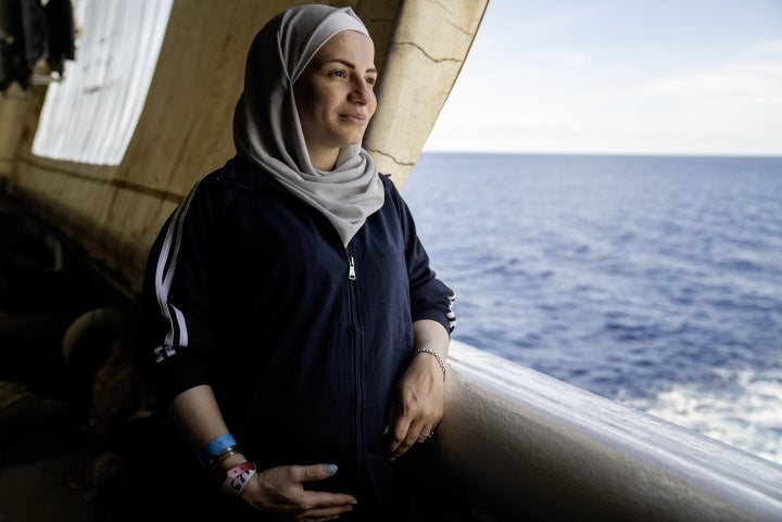 A Syrian woman, seven-month's pregnant, looks out at the Mediterranean Sea from the stern of the Geo Barents, September 20, 2024. 
