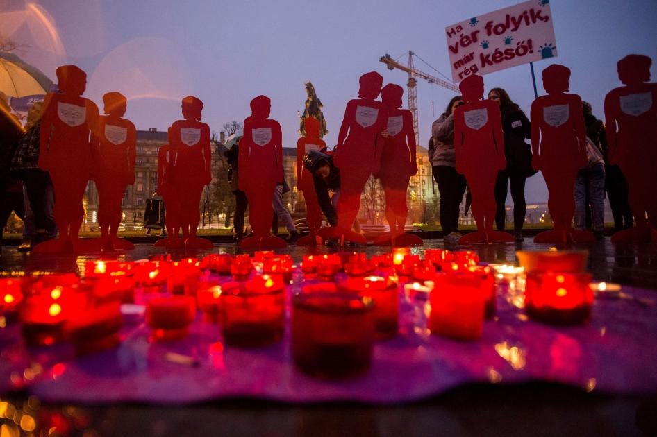Candles and silhouettes representing victims are placed during a rally to mark the International Day for the Elimination of Violence Against Women outside the Parliament in Budapest, Hungary, November 25, 2018.