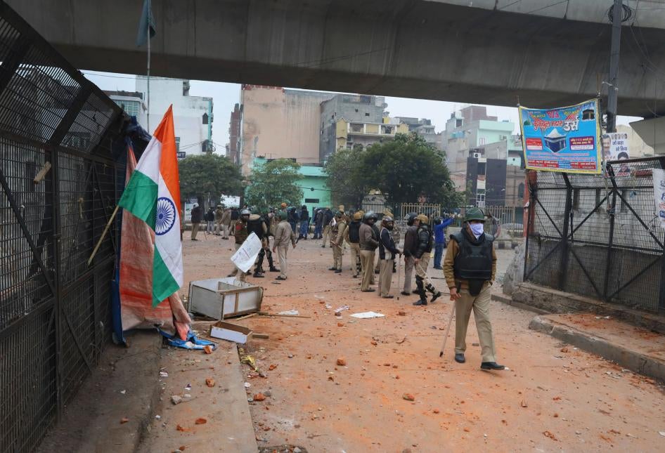 Police stand guard during a protest against a new citizenship law at the Seelampur area of New Delhi, India, February 20, 2020. 