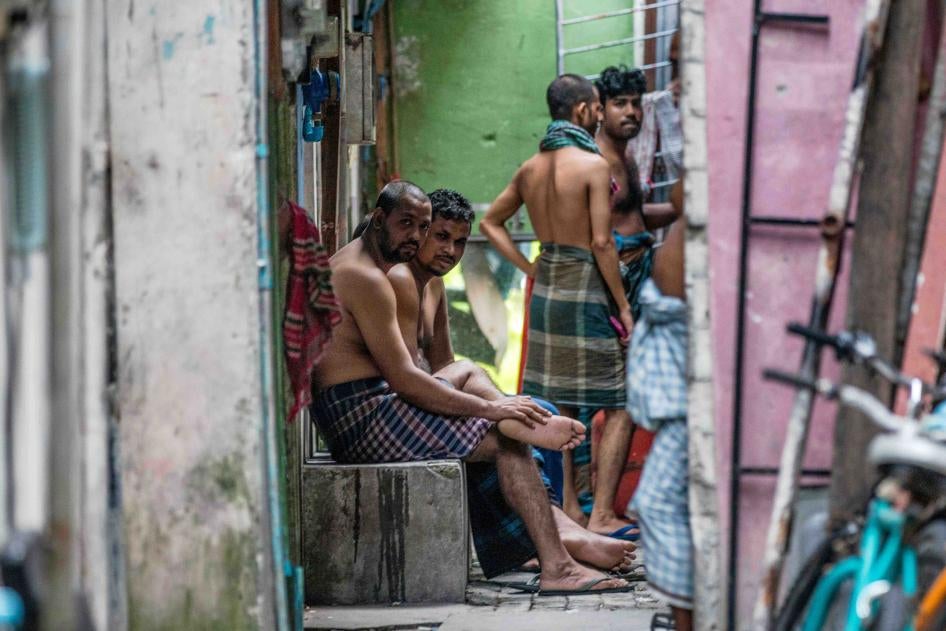 Foreign workers from Bangladesh gather in an alleyway of an accommodation block after being put under quarantine to contain the spread of Covid-19, May 9, 2020 in Male, Maldives. 