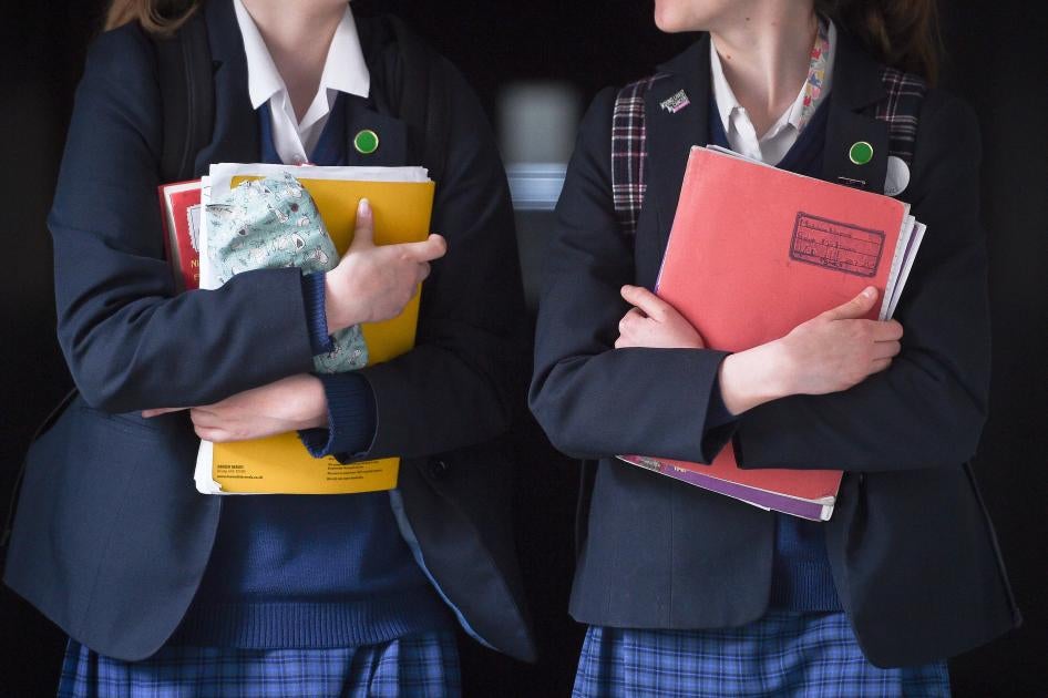 Students walk along a corridor at a school for girls in the U.K. that offers the International Baccalaureate program.