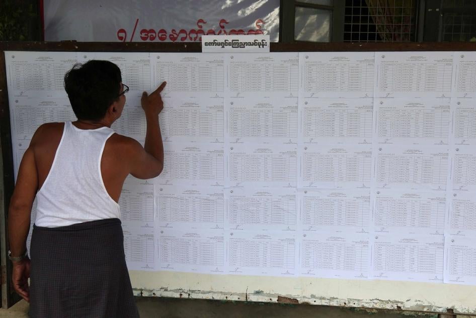 A resident checks voting lists at an administrative office in Yangon ahead of Myanmar’s upcoming general election, July 25, 2020. 