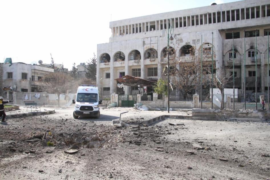 An ambulance in front of a hospital building