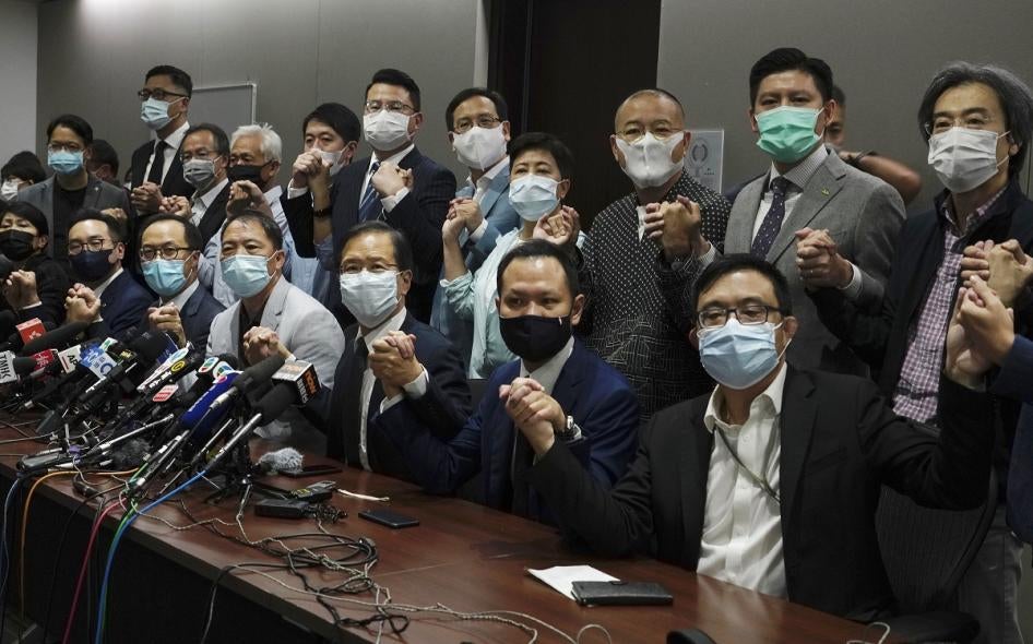Hong Kong's pro-democracy legislators pose for a photo before a press conference at Legislative Council in Hong Kong, Wednesday, Nov. 11, 2020. 