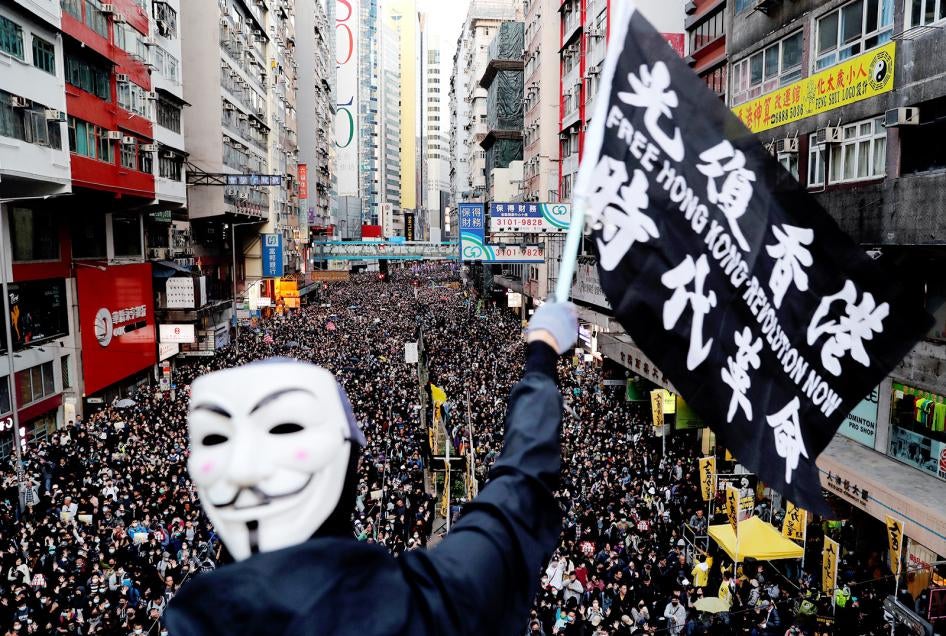 The slogan in Chinese on the flag, “Liberate Hong Kong, the Revolution of Our Times,” was a common chant during the 2019 protests. But since the imposition of the National Security Law, Hong Kong authorities have prohibited both the chant and pro-democracy protests have been prohibited in Hong Kong. The group that has long organized peaceful marches, Civil Human Rights Front, is also no longer functioning and its convenor has been in custody since.