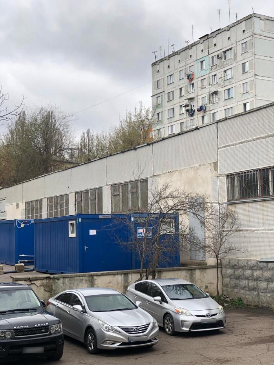 Containers outside of FRISPA with showers. In the first days after Romani refugees from Ukraine moved in, there was only one shower with a small boiler. Chisinau, Moldova, April 2022.