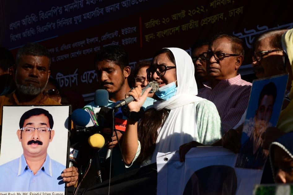Relatives hold portraits of their missing family members during protest rally on behalf of victims of enforced disappearance by security forces, in front of National Press Club in Dhaka, Bangladesh, August 20, 2022.