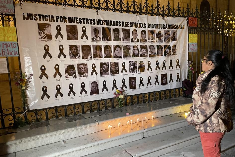 A woman looks at a memorial