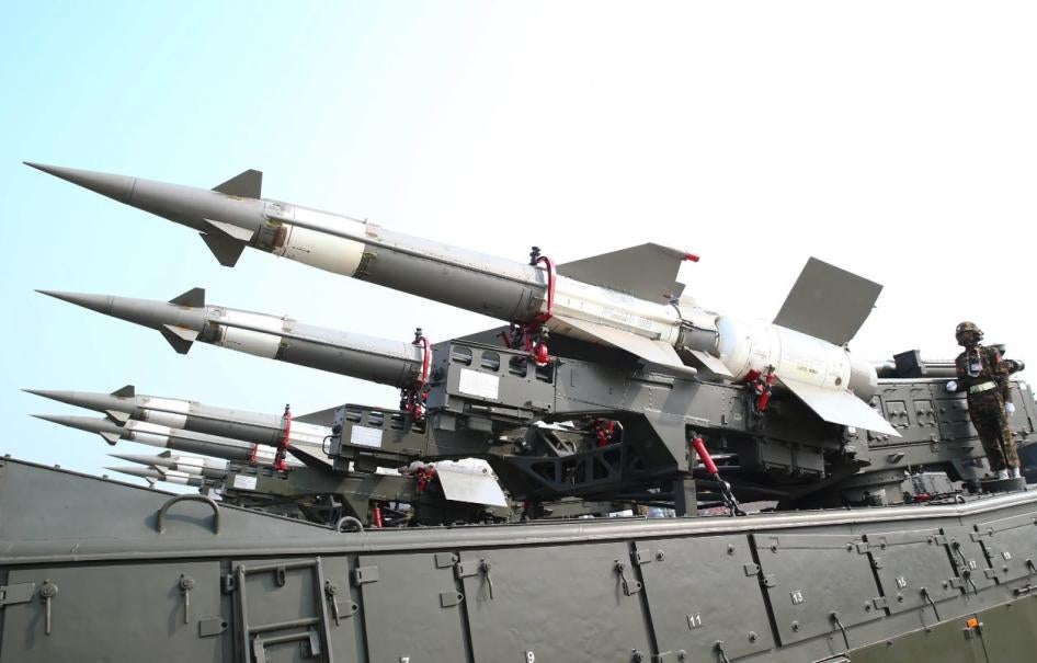 Members of the Myanmar military stand atop trucks loaded with missiles during a parade to commemorate Myanmar's 77th Armed Forces Day.