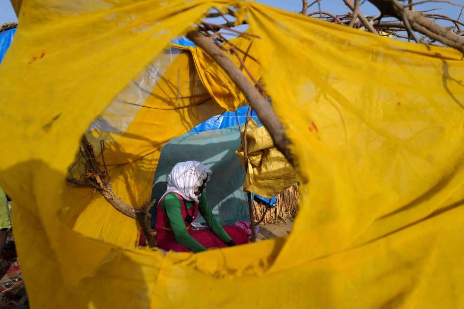 A Sudanese refugee who fled the violence in Sudan's Darfur region, at her makeshift shelter in Koufroun, Chad, May 15, 2023.