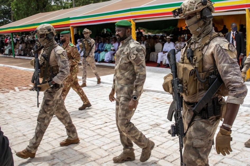 The leader of Mali’s junta, Lt. Col. Assimi Goita, center, attends an independence day military parade on September 22, 2022, in Bamako, Mali. 