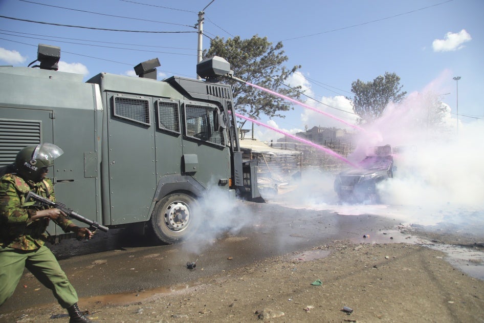 Police use tear gas and water jet spray on an opposition convoy