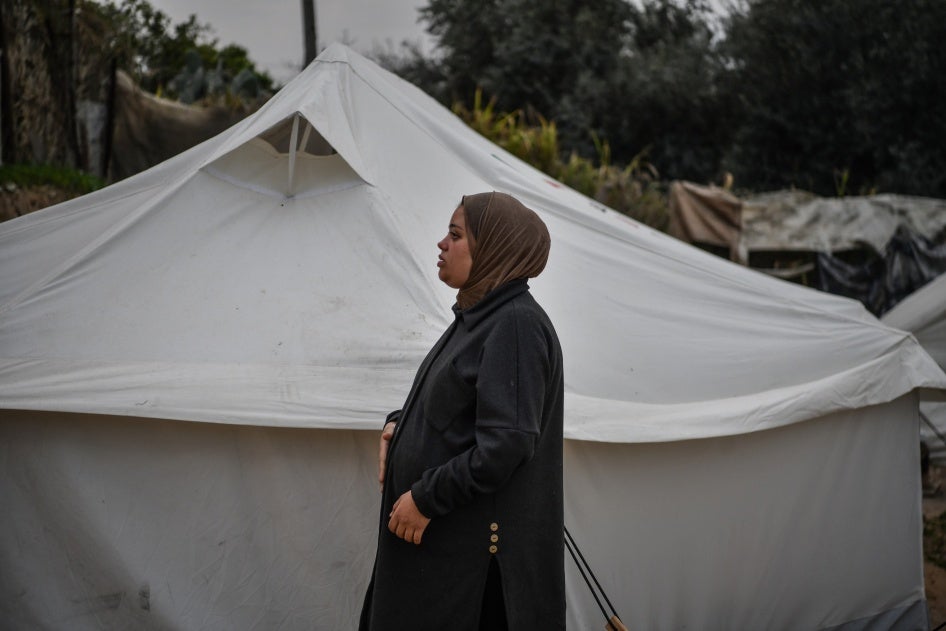 A Palestinian woman pregnant with triplets, suffers from malnutrition and extreme anemia due to food shortages, at a displaced persons camp in Rafah, Gaza, February 14, 2024. 