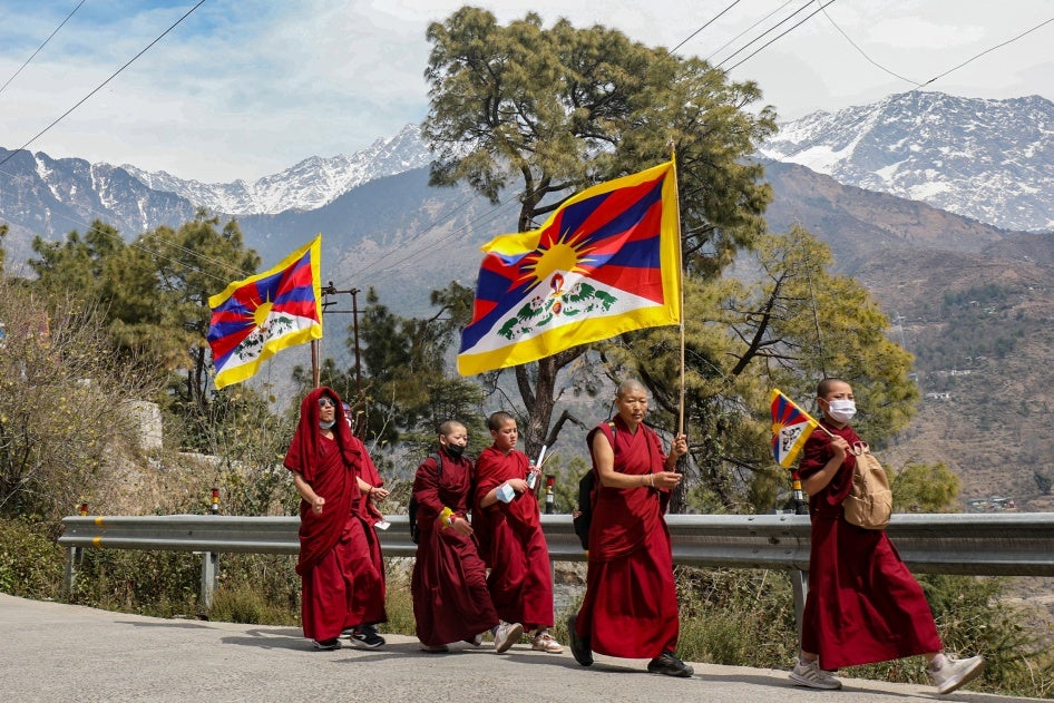 Tibetan monks in exile in India take part in a peace march commemorating the 1959 Tibetan uprising against Chinese rule, near Dharamsala, March 10, 2024.