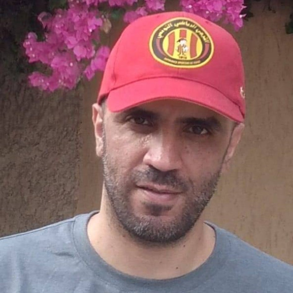 Photo of a man in a baseball cap