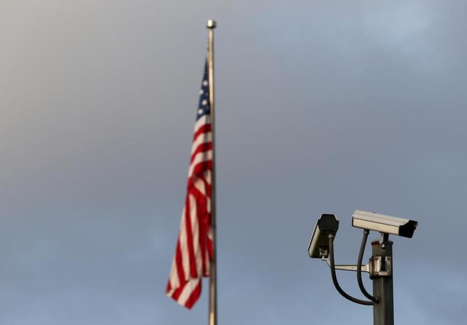 A surveillance camera is pictured in front of the U.S. flag, September 20, 2016.