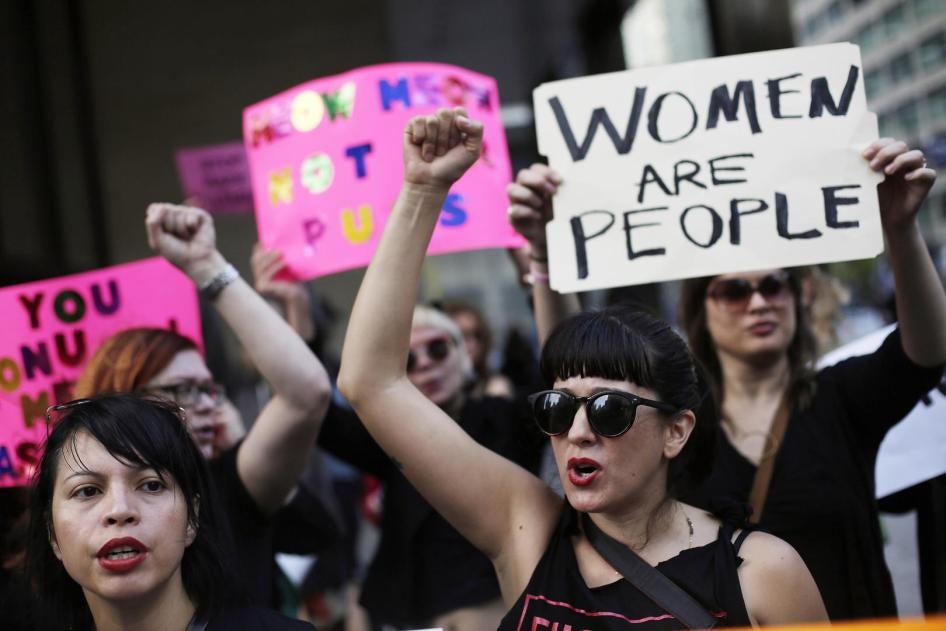 Women take part in a protest against then Republican presidential candidate Donald Trump outside the Trump International Hotel and Tower in Chicago, Illinois, U.S. October 18, 2016