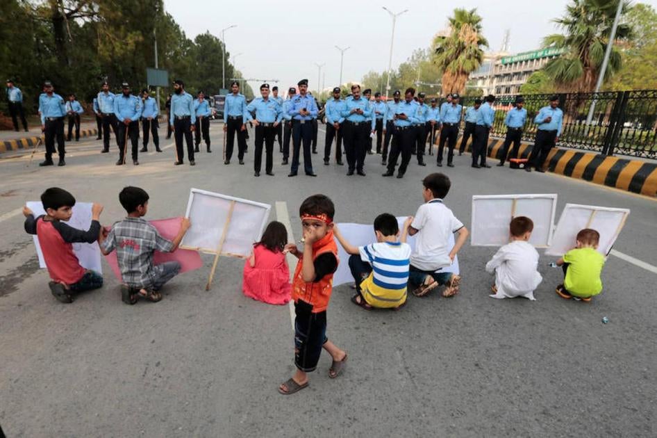 Children hold signs at a protest in Islamabad calling for greater security in the predominantly Shia city of Parachinar, Pakistan, June 27, 2017.