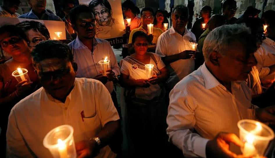 Demonstrators hold candles at a “Black January” vigil to commemorate killings and disappearances of Sri Lankan journalists, Colombo, Sri Lanka, January 24, 2017.
