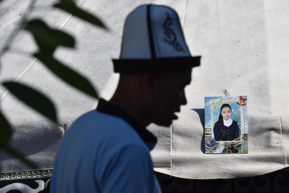 Relatives of Burulai Turdaaly Kyzy, a 20-year-old medical student, hold a traditional ceremony marking 40 days since she was murdered in a police station by her kidnapper.