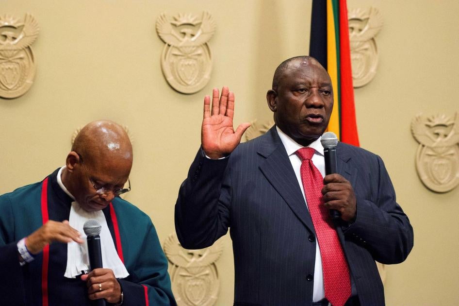 South Africa's new president, Cyril Ramaphosa (right), is sworn into office by South Africa's Chief Justice Mogoeng Mogoeng after being elected by the Members of Parliament at the Parliament in Cape Town, February 15, 2018. © 2018 RODGER BOSCH/AFP/Getty I