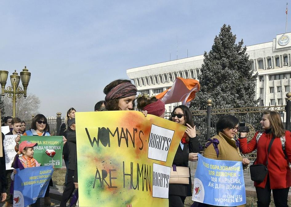 People march through the center of Kyrgyzstan's capital Bishkek for International Women's Day, March 8, 2019.