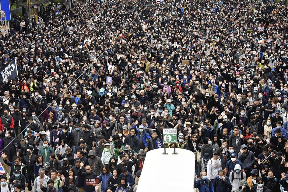 Thousands of protesters march at an avenue in Victoria, Hong Kong Island, Hong Kong on January 1, 2020.