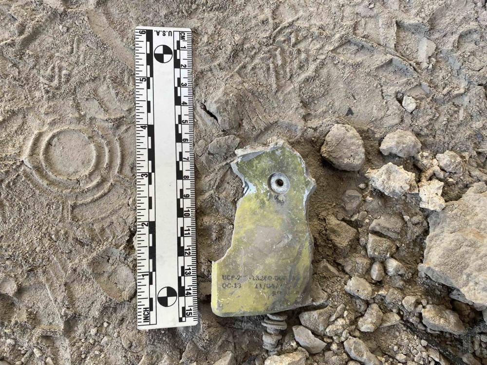 A remnant with alpha-numeric codes and a data plate found at the Ghazanchetsots Cathedral 