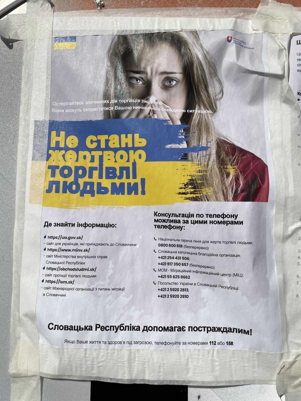 A warning leaflet in Ukrainian with a woman's face on it 