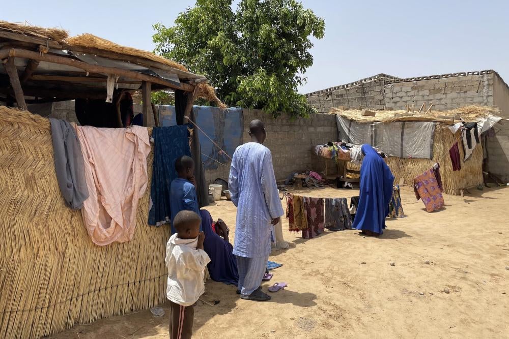A family outside of their home