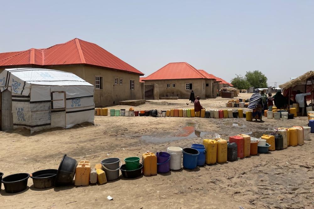 A line of plastic buckets 
