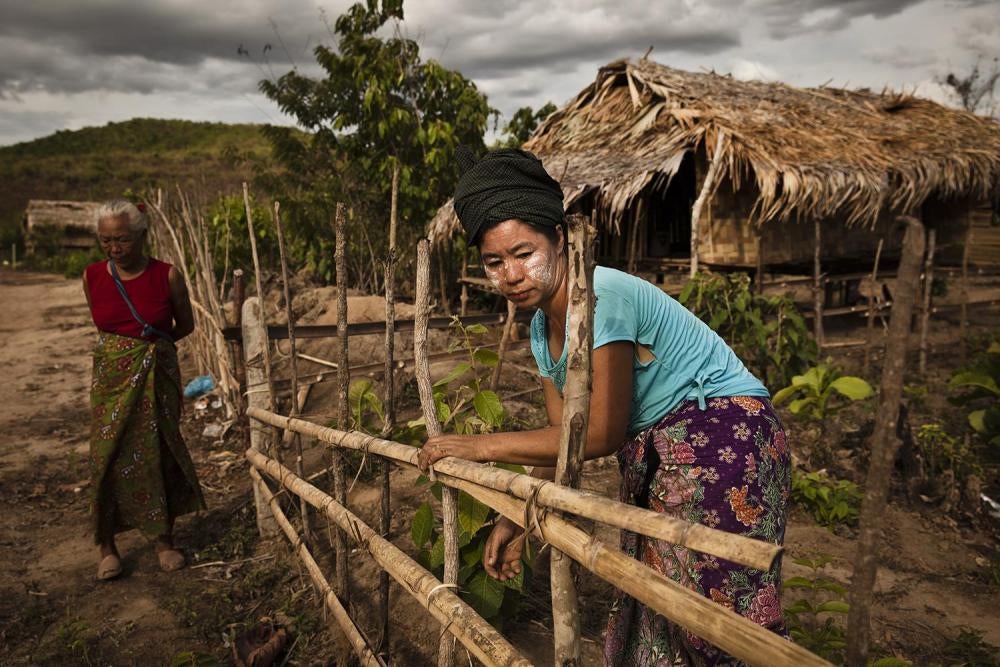 Two villagers in New Ahtet Kawin in front of their homes. 
