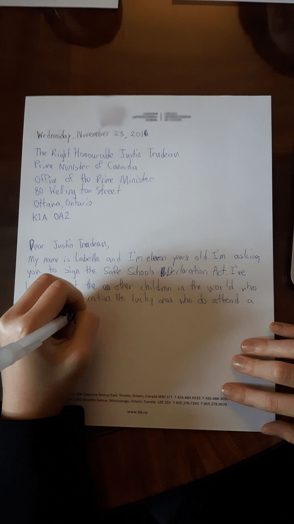 Canadian students taking part in an exercise to urge Justin Trudeau to sign the Safe Schools Declaration and help end attacks on and military use of schools.