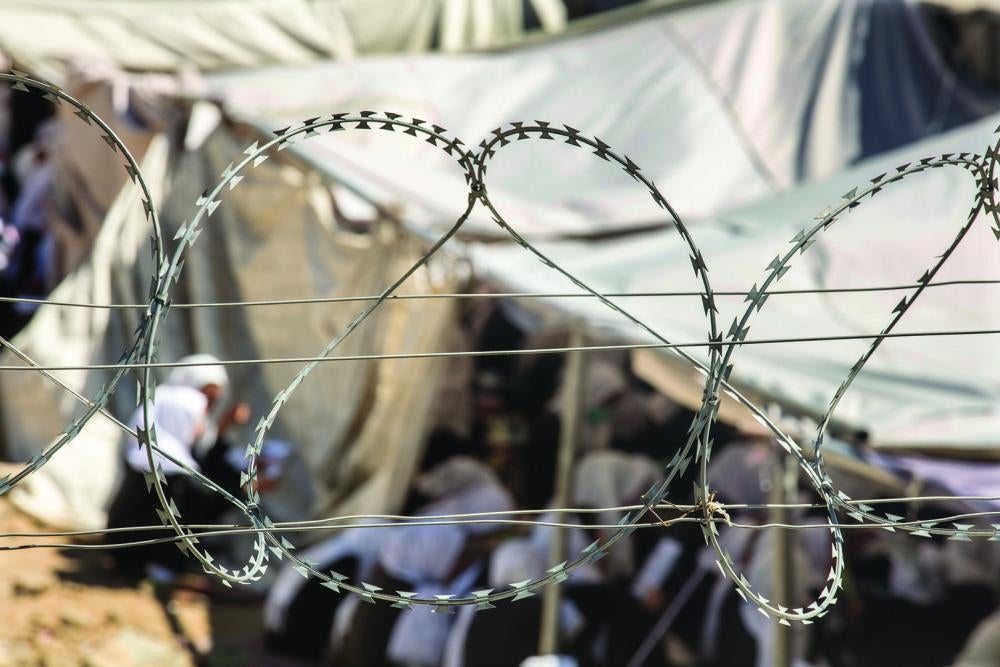 Razor-wire surrounds a government school in Kabul, Afghanistan.