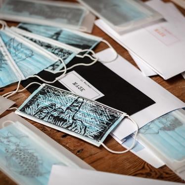 Masks imprinted with artwork by Ai Wei Wei, including symbols of free speech, surveillance, persecution, mass obedience, and defiance. These and others are for sale on eBay for Charity.