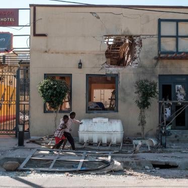 Children in front of the Africa/Ayga hotel likely damaged by a direct fire weapon in Humera town, Tigray region, Ethiopia, on November 22, 2020.