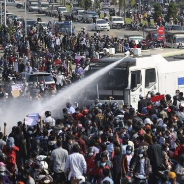 Police use a water cannon on a crowd of protesters in Naypyitaw, Myanmar on Monday, February 8, 2021.
