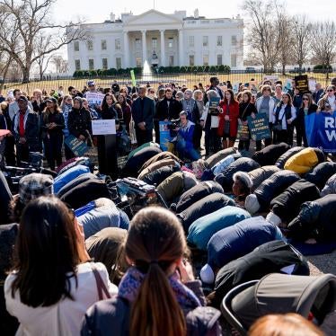 In this file photo, people protest the Trump administration's refugee policies outside the White House in Washington, January 27, 2018. 