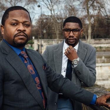 Gradi Koko, right, and Navy Malela, former staff of the audit department at Afriland First Bank CD, on February 17, 2021 in Paris, France.