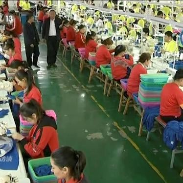 In this file image from undated video footage run by China's CCTV via AP Video, Muslim trainees work in a garment factory at the Hotan Vocational Education and Training Center in Hotan, Xinjiang, northwest China.