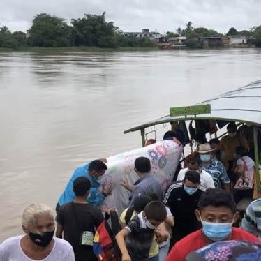 People disembark in Colombia after fleeing Venezuela's Apure state due to a Venezuelan military operation against armed groups in the region, as well as egregious abuses by Venezuelan security forces.