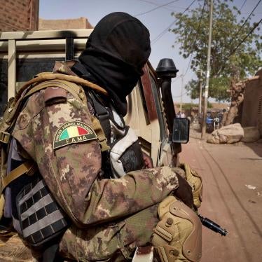 A member of the Malian Armed Forces (FAMA) patrols a road in central Mali, February 2020.