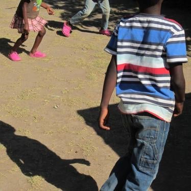 Children play in a backyard
