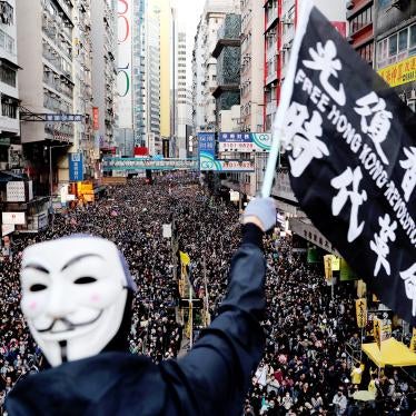 The slogan in Chinese on the flag, “Liberate Hong Kong, the Revolution of Our Times,” was a common chant during the 2019 protests. But since the imposition of the National Security Law, Hong Kong authorities have prohibited both the chant and pro-democracy protests have been prohibited in Hong Kong. The group that has long organized peaceful marches, Civil Human Rights Front, is also no longer functioning and its convenor has been in custody since.