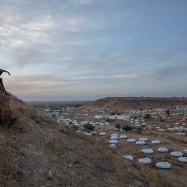 Tigrayan men sit atop a hill overlooking part of the Umm Rakouba refugee camp, in Qadarif, eastern Sudan, on December 14, 2020. 